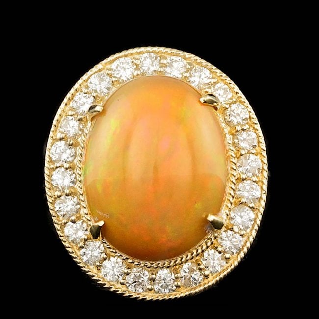 14k Yellow Gold 7.50ct Opal 0.90ct Diamond Ring: Retail: $13,700.00 ****** 14k Yellow Gold 7.50ct Opal 0.90ct Diamond Ring ****** Metal: 14k Solid Yellow Gold / Size: 7 / Total Item Weight: 8.0 grams / Country Made: United States / / Main Stone: Opa