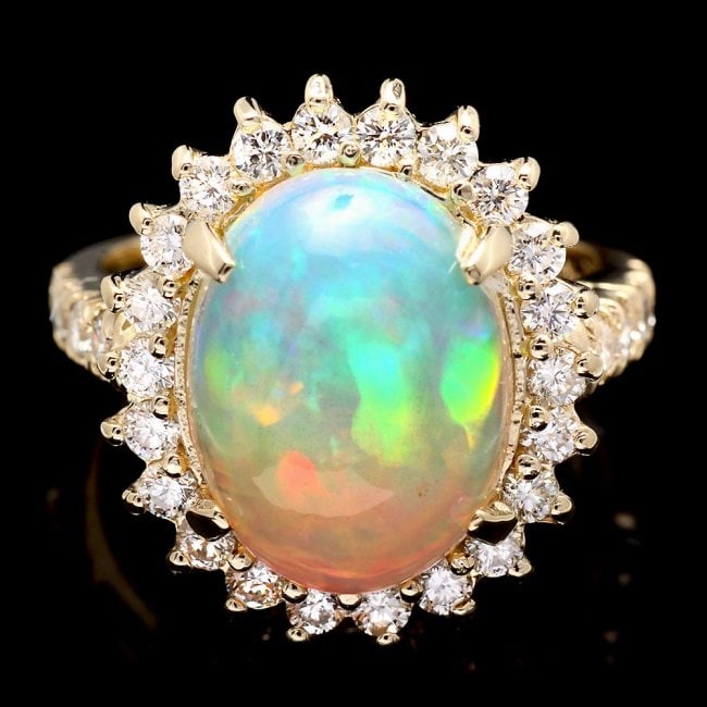 14k Yellow Gold 4.20ct Opal 1.10ct Diamond Ring: Retail: $9,800.00 ****** 14k Yellow Gold 4.20ct Opal 1.10ct Diamond Ring ****** Metal: 14k Solid Yellow Gold / Size: 6.75 / Total Item Weight: 7.0 grams / Country Made: United States / / Main Stone: O