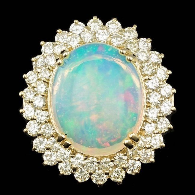 14k Yellow Gold 9.00ct Opal 3.15ct Diamond Ring: Retail: $27,500.00 ****** 14k Yellow Gold 9.00ct Opal 3.15ct Diamond Ring ****** Metal: 14k Solid Yellow Gold / Size: 7 / Total Item Weight: 12.0 grams / Country Made: United States / / Main Stone: Op