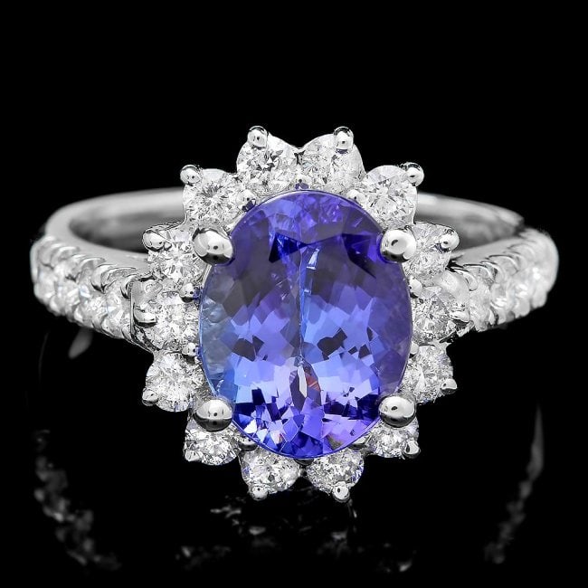 18k Gold 2.00ct Tanzanite 0.80ct Diamond Ring: Retail: $10,650.00 ****** 18k Gold 2.00ct Tanzanite 0.80ct Diamond Ring ****** Metal: 18k Solid White Gold / Size: 6.75 / Total Item Weight: 5.5 grams / Country Made: United States / / Main Stone: Tan