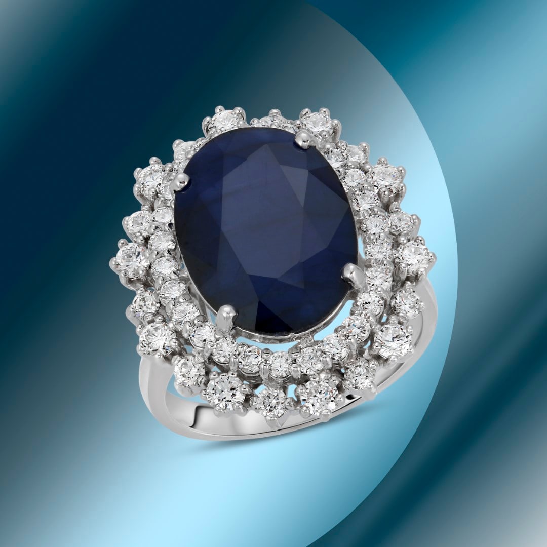 14K Gold 7.11cts Sapphire & 1.39cts Diamond Ring: Retail: $9,780***** 14K Gold 7.11cts Sapphire & 1.39cts Diamond Ring****** Metal: 14K White Gold/ Total Wt.: 8.2g/ Country Made USA// Main Stone: Sapphire/ Carat Total Wt: 7.11cts / Treatment: Diffuss