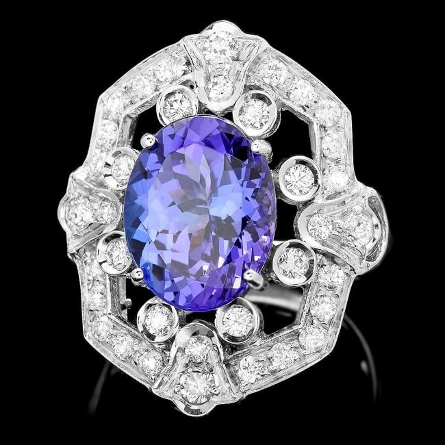 14k Gold 5.50ct Tanzanite 1.00ct Diamond Ring: Retail: $16,750.00 ****** 14k Gold 5.50ct Tanzanite 1.00ct Diamond Ring ****** Metal: 14k Solid White Gold / Size: 7.25 / Total Item Weight: 8.0 grams / Country Made: United States / / Main Stone: Tan