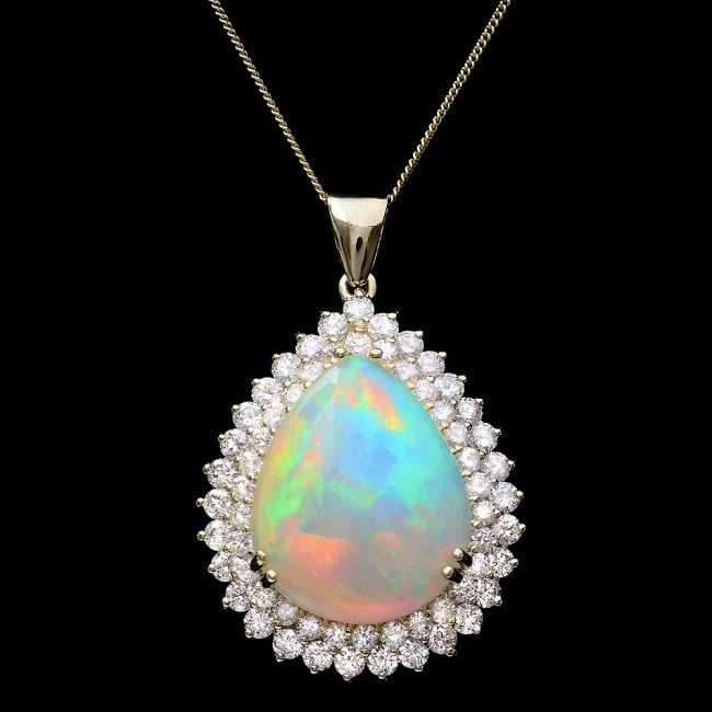 14k Gold 16.00ct Opal 3.50ct Diamond Pendant: Retail: $31,500.00 ****** 14k Gold 16.00ct Opal 3.50ct Diamond Pendant ****** Metal: 14k Solid Yellow Gold / Size: 16 / Total Item Weight: 15.5 grams / Country Made: United States / / Main Stone: Opal