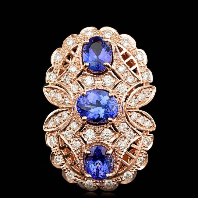 14k Rose 5.50ct Tanzanite 1.60ct Diamond Ring: Retail: $13,100.00 ****** 14k Rose 5.50ct Tanzanite 1.60ct Diamond Ring ****** Metal: 14k Solid Rose Gold / Size: 7.5 / Total Item Weight: 13.5 grams / Country Made: United States / / Main Stone: Tanz