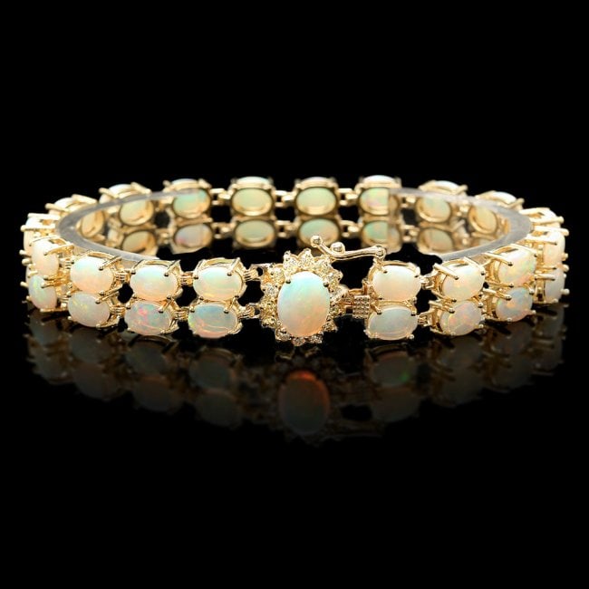14k Gold 14.1ct Opal 0.50ct Diamond Bracelet: Retail: $21,500.00 ****** 14k Gold 14.1ct Opal 0.50ct Diamond Bracelet ****** Metal: 14k Solid Yellow Gold / Size: 7 / Total Item Weight: 21.0 grams / Country Made: United States / / Main Stone: Opal 