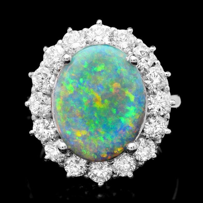 14k White Gold 4.50ct Opal 2.25ct Diamond Ring: Retail: $23,650.00******* 14k White Gold 4.50ct Opal 2.25ct Diamond Ring ****** Metal: 14k Solid White Gold / Size: 7 / Total Item Weight: 8.0 grams / Country Made: USA / / Main Stone: Opal / Color: O