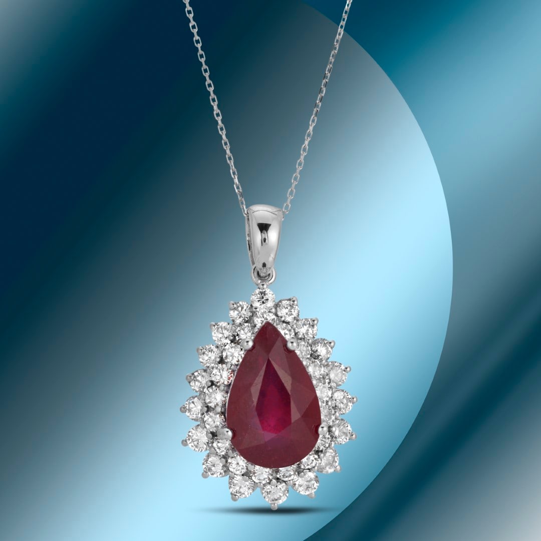 14K Gold 7.02cts Ruby & 2.61cts Diamond Pendant: Retail: $12,560***** 14K Gold 7.02cts Ruby & 2.61cts Diamond Pendant****** Metal: 14K White Gold/ Total Wt.: 8.6g/ Country Made USA// Main Stone: Ruby / Carat Total Wt: 7.02cts / Treatment: Fracture F