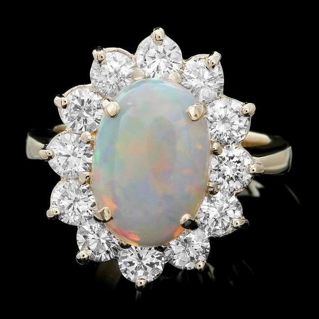 14k Yellow Gold 3.00ct Opal 2.00ct Diamond Ring: Retail: $11,300.00 ****** 14k Yellow Gold 3.00ct Opal 2.00ct Diamond Ring ****** Metal: 14k Solid Yellow Gold / Size: 7 / Total Item Weight: 8.0 grams / Country Made: United States / / Main Stone: Opa