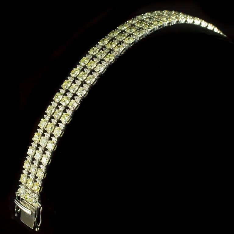 18K Gold 13.95ct Fancy Color Diamond 16.95ct Diamond Bracelet: Retail: $74,425.00 ******Fancy Color Diamond & Diamond Bracelet ****** Metal: 18k Solid White Gold / Total Item Weight: 28.4 grams / Country Made: United States / / Main Stone: Diamond / Carat Total W