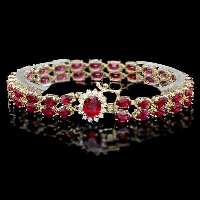 14k Yellow Gold 32ct Ruby 0.60ct Diamond Bracelet: Retail: $16,100.00 ****** 14k Yellow Gold 32ct Ruby 0.60ct Diamond Bracelet ****** Metal: 14k Solid Yellow Gold / Size: 7 / Total Item Weight: 20.5 grams / Country Made: United States / / Main Stone: 