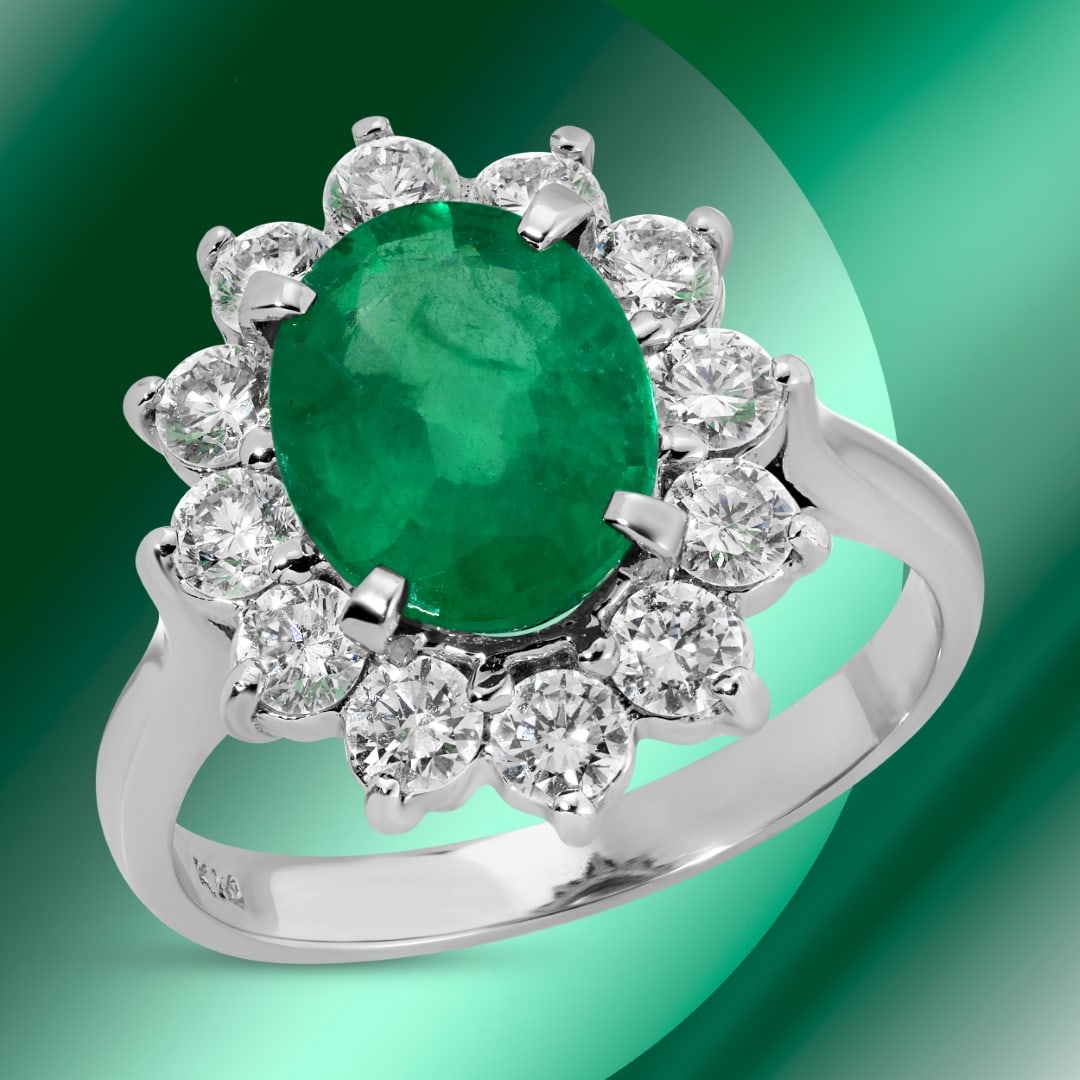 14k Gold 2.00ct Emerald & 1.00ct Diamond Ring: Retail: $12,740*****14k Gold Emerald & Diamond Ring*****Metal: 14K White Gold/ Total Wt.:4.2g / Country Made US// Main Stone: Emerald / Carat Total Wt.: 2.00cts / Treatment: None/ Color: Green / Cut: 