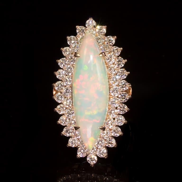 14K Gold 5.33ct Opal 2.85ct Diamond Ring: Retail: $14,987.00****** 14K Gold Opal & Diamond Ring ****** Metal: 14K Solid Rose Gold / Total Item Weight: 13.8 grams / Country Made: United States / / Main Stone: Opal / Color: Play of Color / Cara