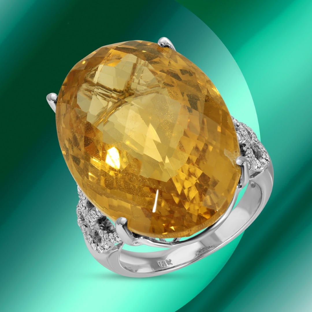 14K Gold 31.96cts Citrine & 0.30cts Diamond Ring: Retail: $7,530*****14K Gold Citrine & Diamond Ring*****Metal: 14K Whte Gold/ Total Wt.: 12.7g / Country Made US// Size 7 / Main Stone: Citrine / Carat Total Wt.:31.96cts / Treatment: none / Color: Ora