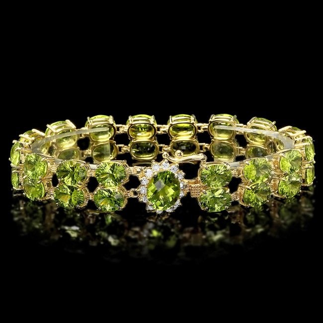 14k Gold 45ct Peridot 0.50ct Diamond Bracelet: Retail: $15,800.00 ****** 14k Gold 45ct Peridot 0.50ct Diamond Bracelet ****** Metal: 14k Solid Yellow Gold / Size: 7.25 / Total Item Weight: 25 grams / Country Made: United States / / Main Stone: Per