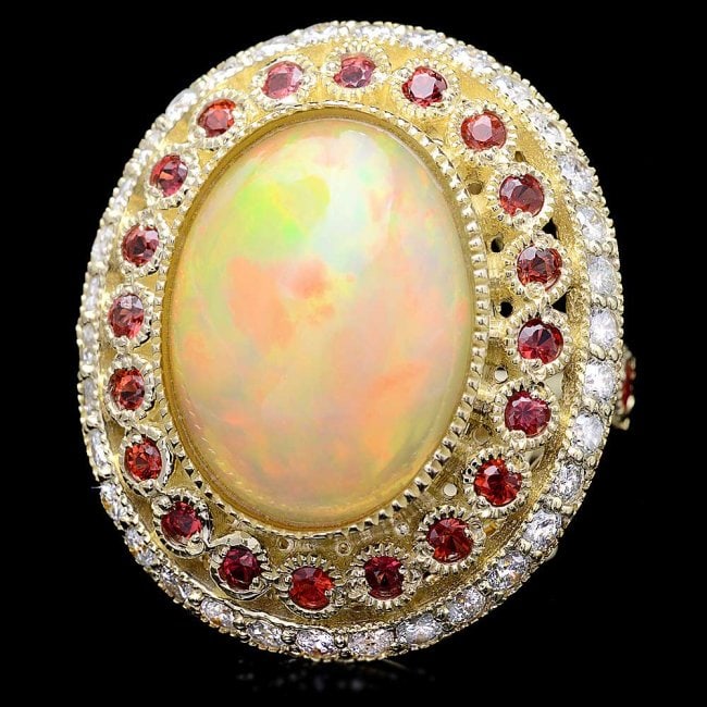14k Yellow Gold 8.00ct Opal 1.20ct Diamond Ring: Retail: $15,800.00 ****** 14k Yellow Gold 8.00ct Opal 1.20ct Diamond Ring ****** Metal: 14k Solid Yellow Gold / Size: 7.5 / Total Item Weight: 14.5 grams / Country Made: United States / / Main Stone: 