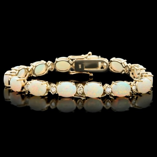14k Gold 15.00ct Opal 1.10ct Diamond Bracelet: Retail: $12,300.00 ****** 14k Gold 15.00ct Opal 1.10ct Diamond Bracelet ****** Metal: 14k Solid Yellow Gold / Size: 7.5 / Total Item Weight: 18.0 grams / Country Made: United States / / Main Stone: Op