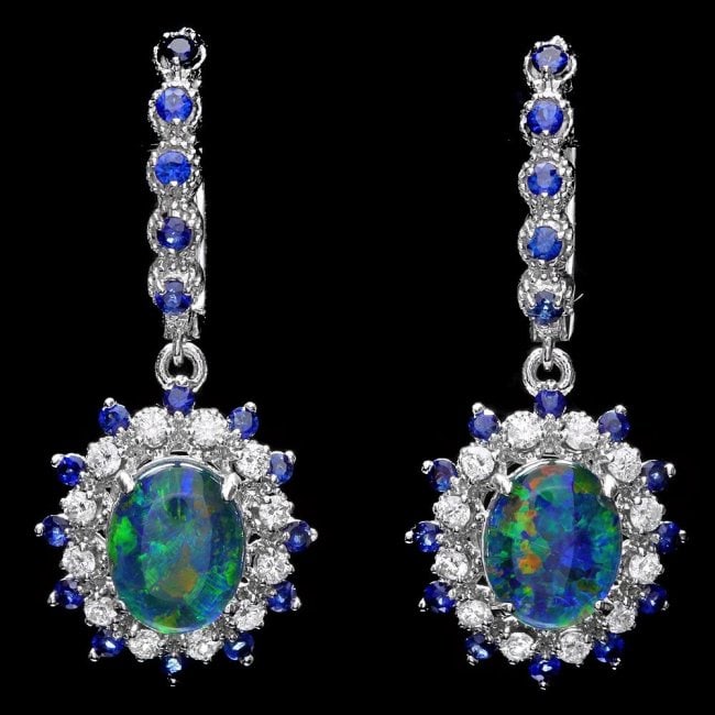 14k Gold 3.00Ct Opal 0.70Ct Diamond Earrings: Retail: $6,900.00******14k Gold 3.00ct Opal 0.70ct Diamond Earrings ****** Metal: 14k Solid White Gold / Total Item Weight: 7.5 grams / Country Made: USA / / Main Stone: Opal / Color: Multi-Colored / 