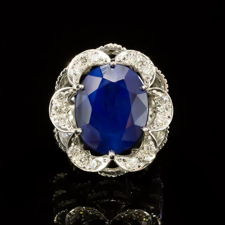 14K Gold 12.34ct Sapphire 0.85ct Diamond Ring: Retail: $10,120.00 ****** 14K Gold Sapphire & Diamond Ring ****** Metal: 14K Solid White Gold / Total Item Weight: 17.9 grams / Country Made: United States / / Main Stone: Sapphire / Color: Blue / Car