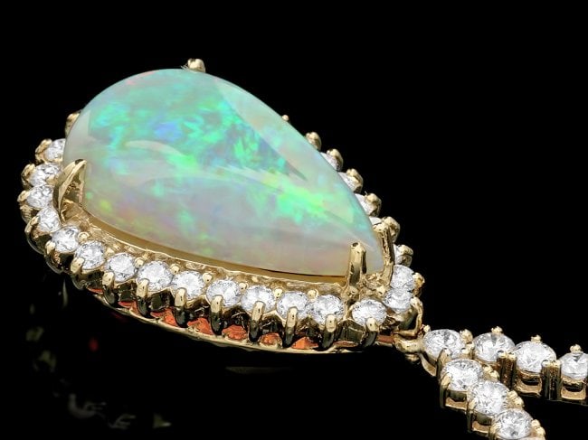14k Gold 9.00ct Opal 6.50ct Diamond Pendant: Retail: $34,700.00 ****** 14k Gold 9.00ct Opal 6.50ct Diamond Pendant ****** Metal: 14k Solid Yellow Gold / Size: 17 / Total Item Weight: 20 grams / Country Made: United States / / Main Stone: Opal / 