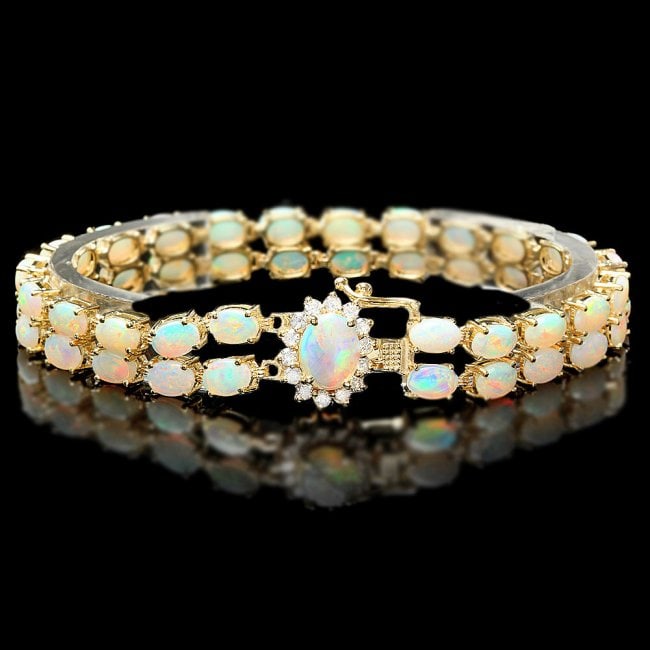 14k Yellow Gold 13ct Opal 0.55ct Diamond Bracelet: Retail: $12,750.00 ****** 14k Yellow Gold 13ct Opal 0.55ct Diamond Bracelet ****** Metal: 14k Solid Yellow Gold / Size: 7 / Total Item Weight: 17.0 grams / Country Made: United States / / Main Stone: 