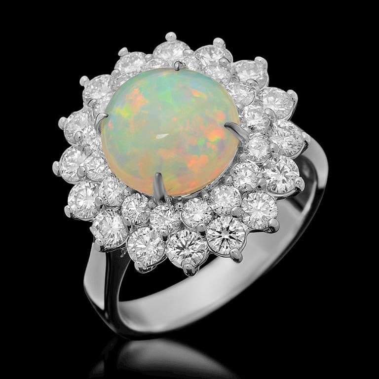 14k Gold 2.73ct Opal 1.95ct Diamond Ring: Retail: $9,925.00 ******14k Gold Opal & Diamond Ring ****** Metal: 14K Solid White Gold / Total Item Weight: 7.5 grams / Country Made: United States / / Main Stone: Opal / Color: Play of Color / Carat