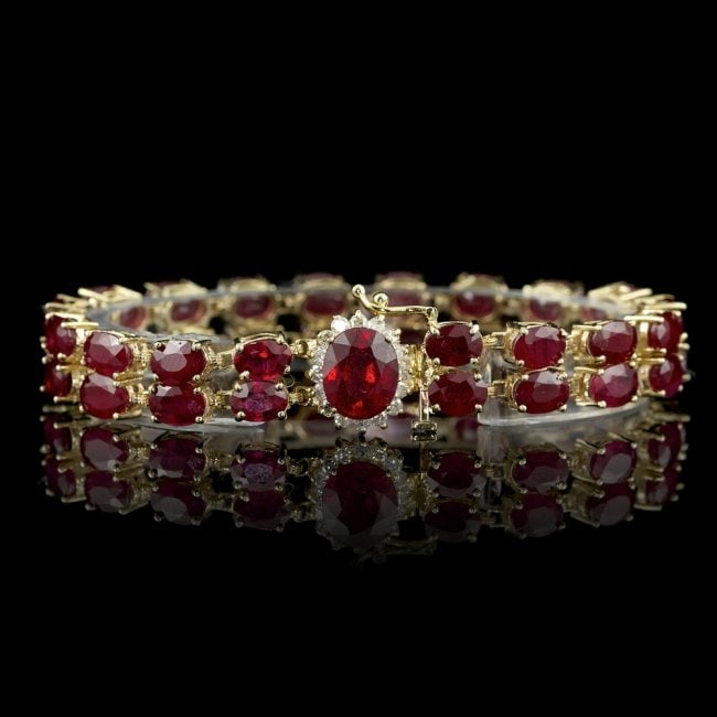 14k Yellow Gold 50ct Ruby 0.75ct Diamond Bracelet: Retail: $14,700.00 ****** 14k Yellow Gold 50ct Ruby 0.75ct Diamond Bracelet ****** Metal: 14k Solid Yellow Gold / Total Item Weight: 27.0 grams / / Main Stone: Ruby / Color: Red / Carat Total Weight: 