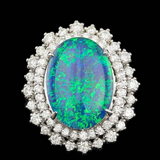 14k White Gold 6.50ct Opal 1.15ct Diamond Ring: Retail: $11,700.00 ****** 14k White Gold 6.50ct Opal 1.15ct Diamond Ring ****** Metal: 14k Solid White Gold / Size: 6.75 / Total Item Weight: 9.5 grams / Country Made: United States / / Main Stone: Op