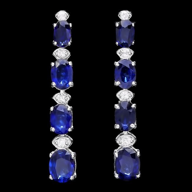 14k Gold 6ct Sapphire .35ct Diamond Earrings: Retail: $5,700.00 ****** 14k Gold 6ct Sapphire .35ct Diamond Earrings ****** Metal: 14k Solid White Gold / Total Item Weight: 5.5 grams / Country Made: United States / / Main Stone: Sapphire / Color: 