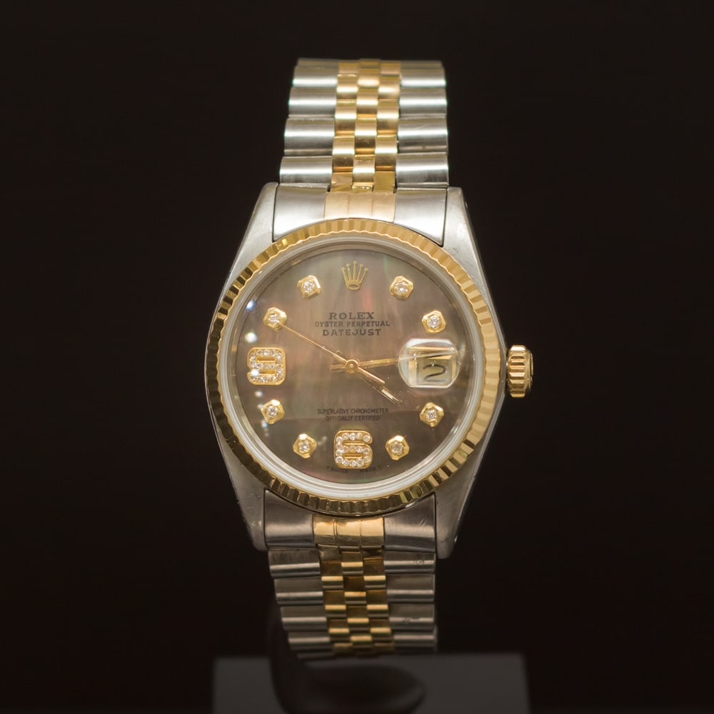 Rolex Two-Tone Datejust 36mm Brown Mother of Pearl Dial w/Diamonds on 9th & 6th Hour Wristwatch: ****** Rolex Two-Tone Datejust 36mm Brown Mother of Pearl Dial w/Diamonds on 9th & 6th Hour ****** One Mens, Rolex Two-Tone DateJust 36mm electronically tested and polished. Case: Gold/Stainless Steel