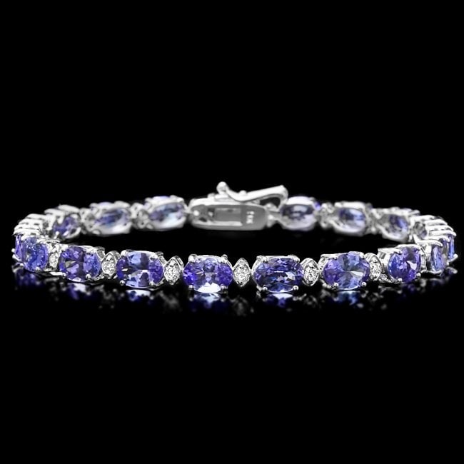 14k Gold 14ct Tanzanite 0.60ct Diamond Bracelet: Retail: $11,300.00 ****** 14k Gold 14ct Tanzanite 0.60ct Diamond Bracelet ****** Metal: 14k Solid White Gold / Size: 7.25 / Total Item Weight: 10 grams / Country Made: United States / / Main Stone: Ta