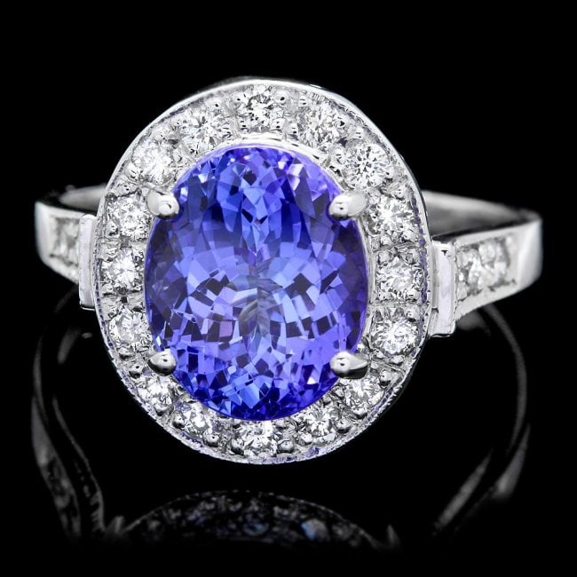 14k Gold 4.00ct Tanzanite 0.50ct Diamond Ring: Retail: $10,400.00 ****** 14k Gold 4.00ct Tanzanite 0.50ct Diamond Ring ****** Metal: 14k Solid White Gold / Size: 7 / Total Item Weight: 5.0 grams / Country Made: United States / / Main Stone: