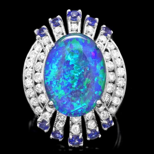 14k White Gold 5.00ct Opal 1.55ct Diamond Ring: Retail: $7,200.00 ****** 14k White Gold 5.00ct Opal 1.55ct Diamond Ring ****** Metal: 14k Solid White Gold / Size: 7 / Total Item Weight: 8.0 grams / Country Made: United States / / Main Stone: Opal /