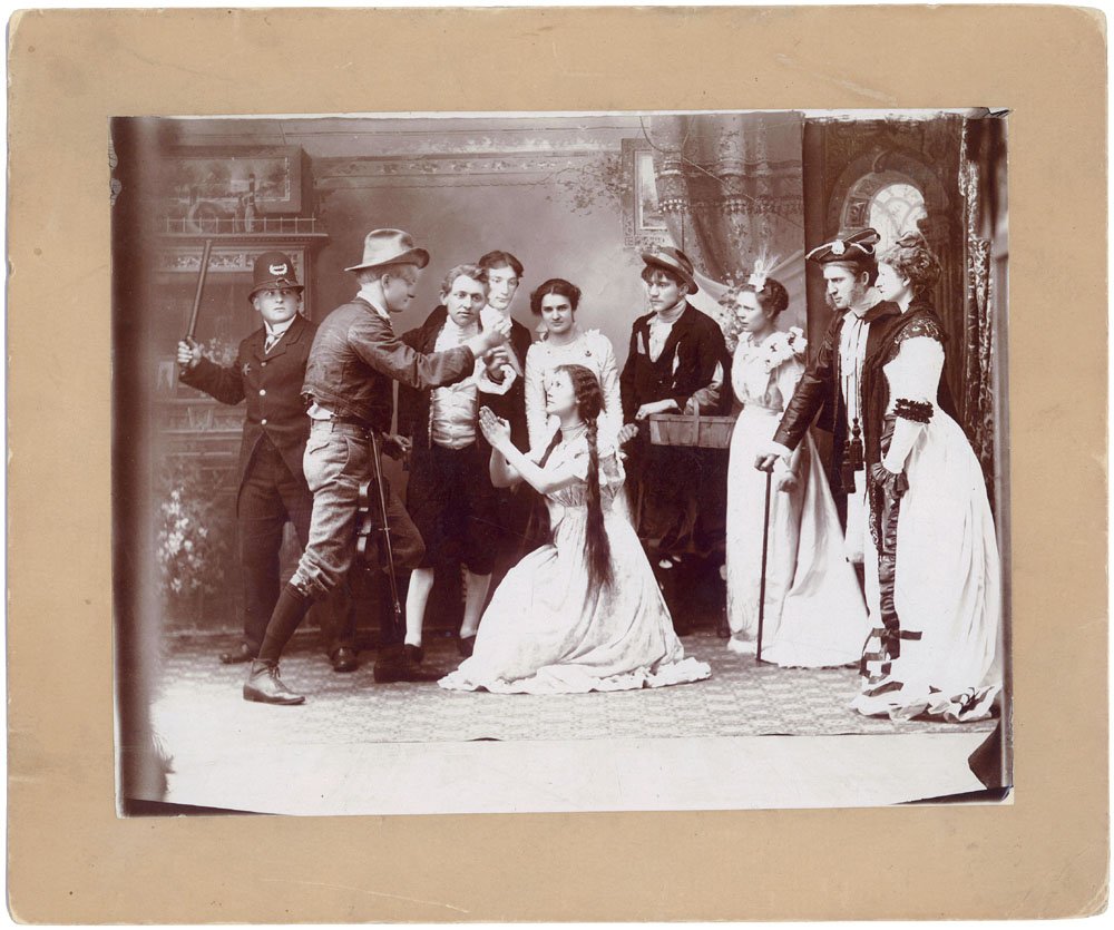 Theatre Scene Original c1910 Real Photo-Death, Stabbing: This is a unique vintage real photo of a staged theatre scene. Amid an array of unusual people, a man with a violin is trying to stab a girl who is begging for mercy. A policeman is holding up his bil