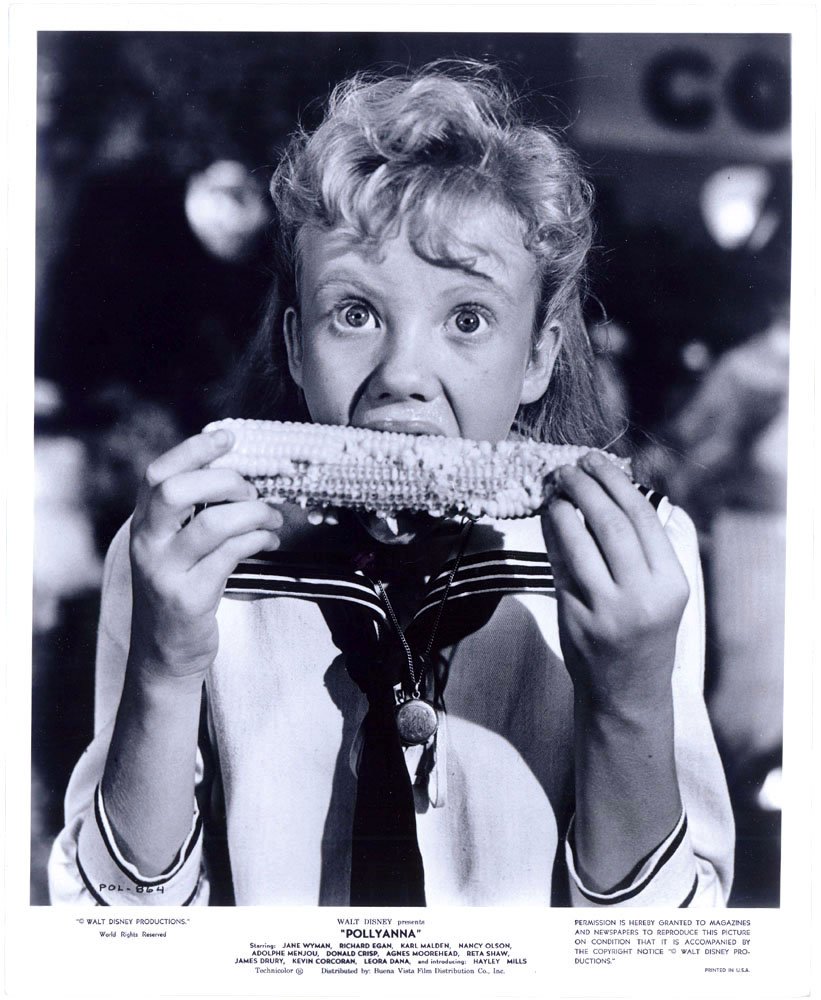 Hayley Mills as POLLYANNA Orig. 1960 Photo-Eating Corn: This is a VINTAGE 1960 black-and-white photo promoting the movie Pollyanna with Hayley Mills. Adorable and classic image of Haley Mills. Stamped on reverse with 1975 date when it was pulled and used f