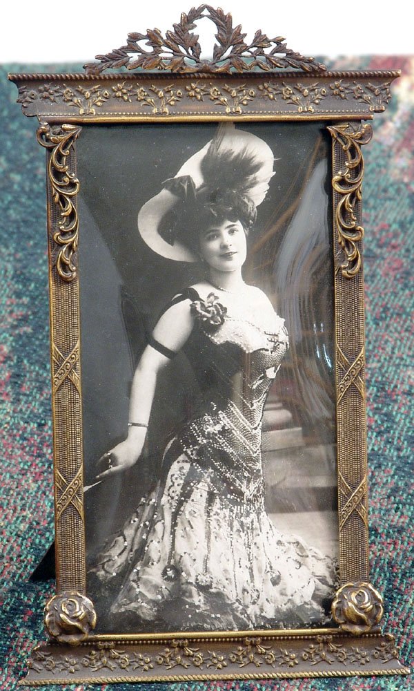 Old Edwardian Frame-Superb Ornate Metal/Convex Glass: This is a beautiful antique Edwardian-era frame. Decorative ornate metal detail.Convex glass--old, you can see a few of the small bubbles in it. Metal slip-in back with easel stand. RPPC of young Edwa