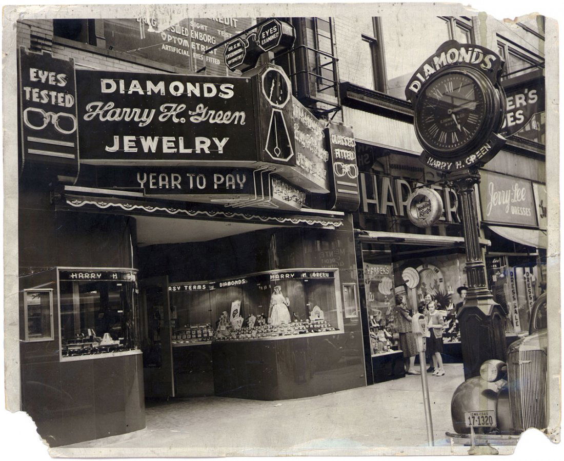 Vintage 1940 Photo Harry H. Green Jewelry Store Iowa: This is a vintage c1940 photo of Harry H. Green Diamonds & Jewelry. Also seen is the front of car with what looks like a Chevrolet grill badge and the "winged woman" hood ornament that Chevrolets spor