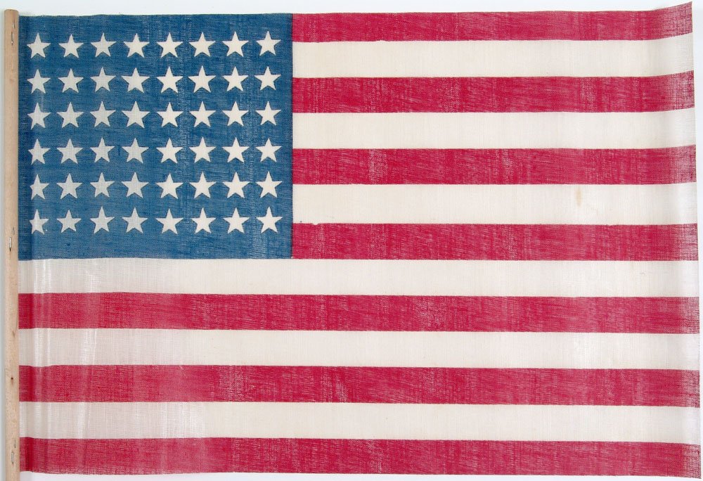 Old 48 Star American Parade Flag - Linen on Wood Staff: This is a fantastic vintage 48-star American parade flag. Loose weave linen. On a natural wood staff. SIZE: 17" x 12". 30" staff. ****** We provide in-house shipping. Low shipping costs! Combine items