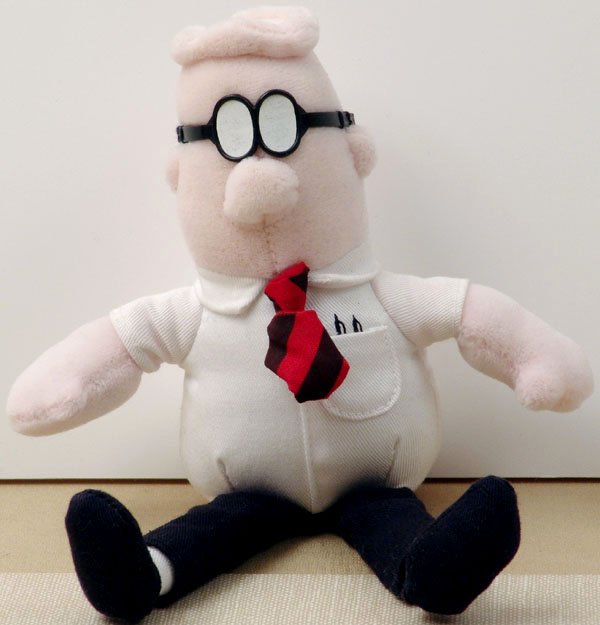 Group of 8 Vintage DILBERT Collectibles - Dolls, Books: This is a grouping of vintage mid-90s Dilbert collectibles. Lot includes: A stuffed plush Dilbert. Approx. 9" high standing and 6" high sitting. A stuffed plush Dogbert. Approx. 7" high standing and 5