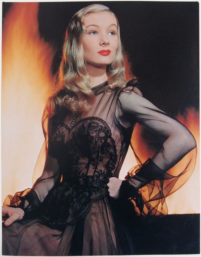 Photo Print VERONICA LAKE I Married a Witch: This is a photo print of actress Veronica Lake. Written on the back is Veronica Lake in "I Married a Witch" 1942. It looks like this was taken out of a book of celebrities of that era, but we don't kn