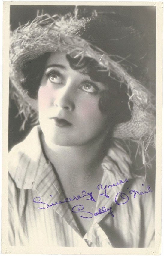 SALLY O'NEIL c1930s Signed Photo Silent Film Star: This is a vintage circa 1930s photo of film star SALLY O'NEIL. The signature appears to be stamped on the photo, but I can't be sure. It is on top of the photo and not printed from the negative. SIZE:
