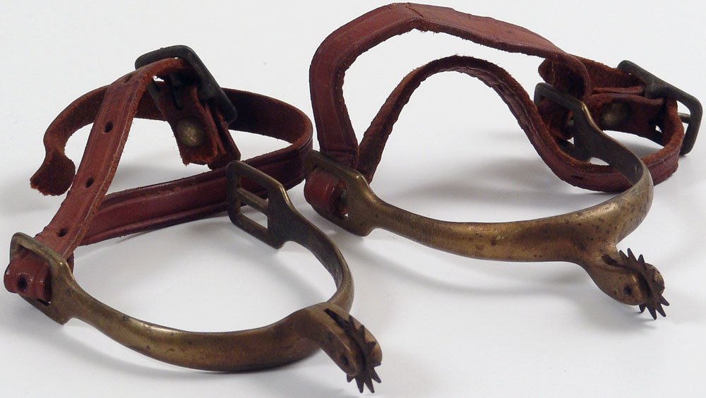 Vintage Pair of Solid Brass Cowboy Spurs - Orig Straps: This is a pair of vintage brass spurs with what look to be the original leather straps. SIZE: Approx. 2 3/4" heel opening and approx. 4 1/2" long overall. ****** We provide in-house shipping. Low ship