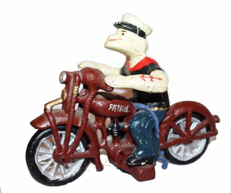 Cast Iron Popeye on Motorcycle: Cast iron Popeye on motorcycle. Good paint, Crude construction.