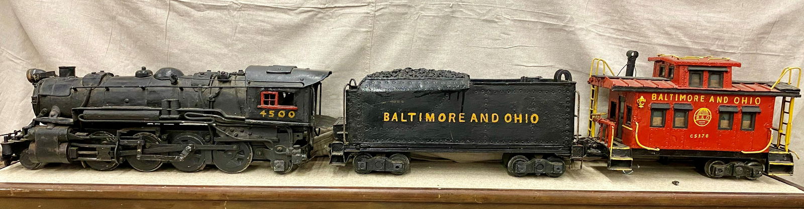 B&O Engine with 3 Cars: Engine & three cars. This accurately detailed 4 piece, hand fabricated, 1:16 gauge train set features an early 20th C. sytle steam locomotive in a 2-8-2 configuration for 3-1/2" track. 30" in length a