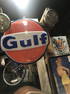 Large round sign advertising Gulf.  Light Up.