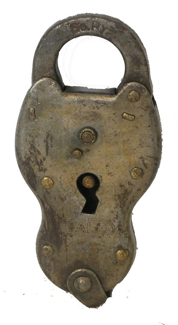 Brass colored lock in somewhat hourglass shape from (1 of 1)