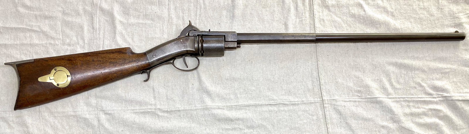 James Warner Open Frame Revolving Carbine, circa 1849,: James Warner Open Frame Revolving Carbine, circa 1849, Springfield Mass. Open frame design with manually rotated cylinder, deeply grooved for firing nipples. The barrel is half octagonal and half roun