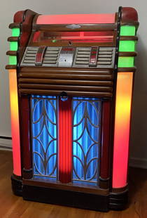 AMI STREAMLINER JUKIBOX: AMI STREAMLINER 78 SPEED 20 SELECTION 10 RECORDS DIMENSIONS 133 x 89 x 64 cm (53 x 35 x 25") EXTREMELY RARE, ONLY A HANDFUL KNOWN, 20 SELECTION, C.1938-40, GOOD CABINET & SIDE PLASTICS