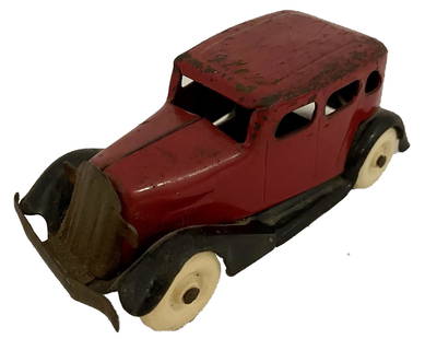 PRESSED STEEL BURGANDY AND BLACK SEDAN WITH WHITEWALL TIRES: PRESSED STEEL BURGANDY AND BLACK SEDAN WITH WHITEWALL TIRES