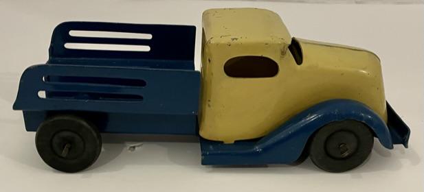 BLUE AND YELLOW METAL TRUCK: VINTAGE YELLOW AND BLUE METAL TRUCK MEASURING 7 L X 3 INCHES IN HEIGHT