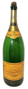 VINTAGE GLASS VEUVE CLICQUOT CHAMPAGNE DISPLAY BOTTLE: MID CENTURY GLASS VEUVE CLICQUOT CHAMPAGNE BOTTLE MEASURES APPROXIMATELY 27 INCHES TALL AND 8 INCH DIAMETER USED AS DISPLAY OR STOREFRONT FOR ADVERTISEMENT